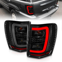 Load image into Gallery viewer, ANZO 1999-2004 Jeep Grand Cherokee LED Tail Lights w/ Light Bar Black Housing Smoke Lens