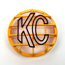 Load image into Gallery viewer, KC HiLiTES 6in. Round ABS Stone Guard for SlimLite/Daylighter Lights (Single) - Yellow/Black KC Logo