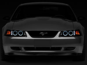 Raxiom 99-04 Ford Mustang Dual LED Halo Projector Headlights- Black Housing (Smoked Lens)